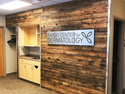 Fargo Center for Dermatology Custom Aluminum Signage and Reclaimed Wall Paneling